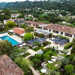 Aerial view of a five-star Provençal hotel with pool and gardens